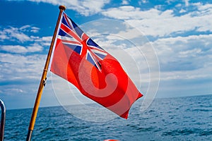 Uk red ensign the british maritime flag flown from yacht photo