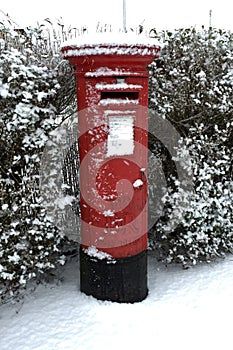 UK Red Postbox in the snow