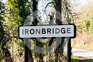 A UK road sign stating Shropshire town of Ironbridge