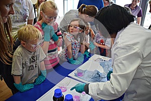 Laboratory chemists take a day out of the lab to teach children about chemistry as part of the UK STEM, science, technology,engine