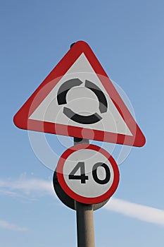 UK roundabout ahead and 40mph reminder signs