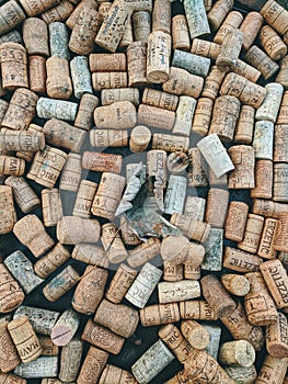 10.10.2020. Ukanc, Slovenia. Background of many vintage wine corks on the table in restaurant. Top view. Party and holiday concep