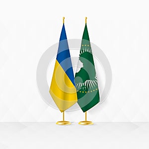 Ukraine and African Union flags on flag stand, illustration for diplomacy and other meeting between Ukraine and African Union