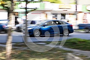 Ukraine, Bila Tserkva - 19 September 2020: Blue car moving on the street of city