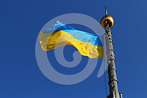 Ukraine flag on blue sky background