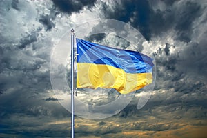 Ukraine flag. Ukrainian flag on black storm cloud sky.