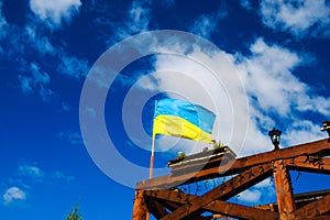 Ukraine flag waving on the wind against the blue sky