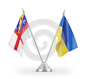 Ukraine and Herm table flags isolated on white 3D rendering