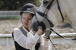 Ukraine, Kiev. The rider girl hugs the horse`s head