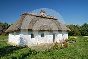 Ukraine. Kiev. White clay house with a thatch