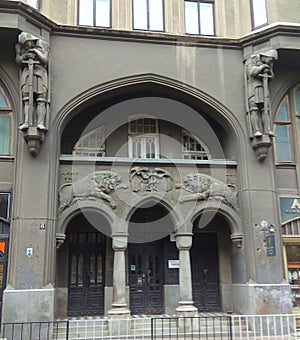 Ukraine, Lviv, Knyazya Romana street, 6, facade of an old building with lions