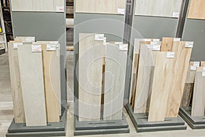 Ukraine - March 27,2019 : Picture of different modern ceramic tile, basin and laminated flooring in shop