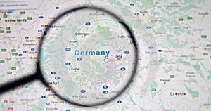 UKRAINE, ODESSA - APRIL 25, 2019: Germany on google maps through magnifying glass.