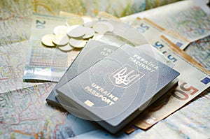 Ukraine passport with money on the map