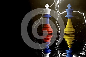 Ukraine and Russia flags paint over on chess king. 3D illustration Ukraine vs Russia crisis