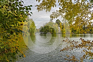 Ukraine, Uman: autumn yellow trees near forest lake landscape, Sofievka park