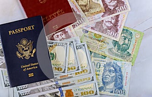 Ukrainian biometric passport and Hungarian passport money on US dollars and money banknotes forints
