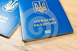 Ukrainian biometric passport id to travel the Europe without visas on the table. Inscription in Ukrainian