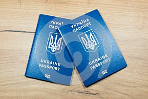 Ukrainian biometric passport id to travel the Europe without visas on the table. Inscription in Ukrainian