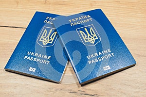 Ukrainian biometric passport id to travel the Europe without visas on the table. Inscription in Ukrainian