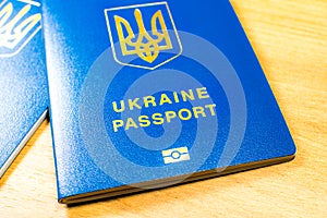 Ukrainian biometric passport id to travel the Europe without visas on the table. Inscription in Ukrainian