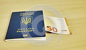 Ukrainian biometric passport id to travel the Europe without visas on the table. Inscription in Ukrainian Ukraine