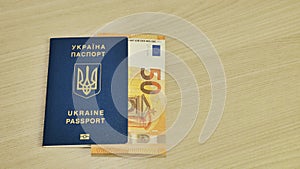 Ukrainian biometric passport id to travel the Europe without visas on the table. Inscription in Ukrainian Ukraine