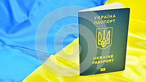 Ukrainian biometric passport id to travel the Europe without visas on the table. Inscription in Ukrainian Ukraine