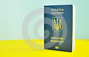 Ukrainian biometric passport id to travel the Europe without visas on the table. Inscription in Ukrainian Ukraine