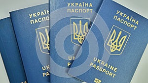 Ukrainian biometric passport id to travel the Europe without visas on the table. Inscription in Ukrainian Ukraine