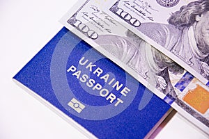 Ukrainian biometric passport and two banknotes for a hundred dollars