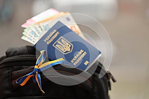 Ukrainian biometrical passport and Euro money with Airlines avia tickets on touristic backpack