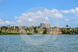 Ukrainian block of flats on the Danube river shore seen from romanian side - Danube river Ukraina - steep ground wall - Ucraina