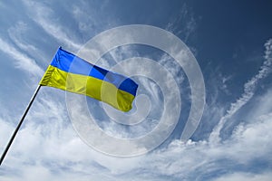 Ukrainian blue and yellow flag opposite the sky