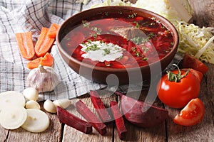 Ukrainian borsch and ingredients on the table close-up. horizontal