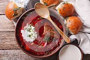 Ukrainian borsch soup with sour cream close-up. horizontal top v photo