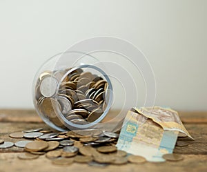 Ukrainian coins and hryvnas shows poverty
