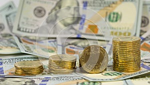 Ukrainian currency grivna (hryvnia,1 UAH) on the background of 100 dollar USA bills (100 USD)