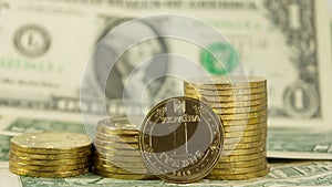 Ukrainian currency hryvnia (grivna) on the background of 1 dollar USA bills (1 USD)
