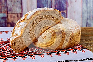 Ukrainian embroidery freshly baked sliced bread on rustic wooden table