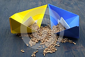 Ukrainian flag colors origami boats and wheat