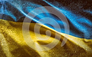 Ukrainian flag with concrete background blowing in the wind photo