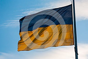 Ukrainian flag at the evening with sky on background