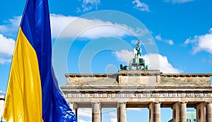 Ukrainian flag in front of Brandenburg Gate during anti war demonstration against Russian invasion of Ukraine.