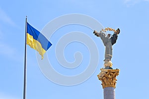 Ukrainian flag and Monument to Berehynia in Kiev