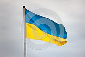 Ukrainian flag waving against the sky