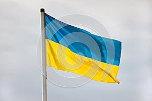 Ukrainian flag waving against the sky