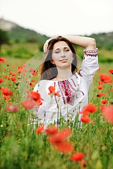 Ukrainian girl in field of poppies