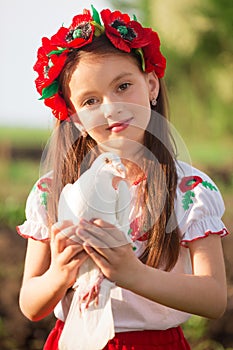 Ukrainian girl with a white dove in her hands