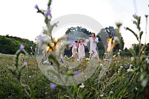 Ukrainian girl in a white sundress with a wreath of flowers on h